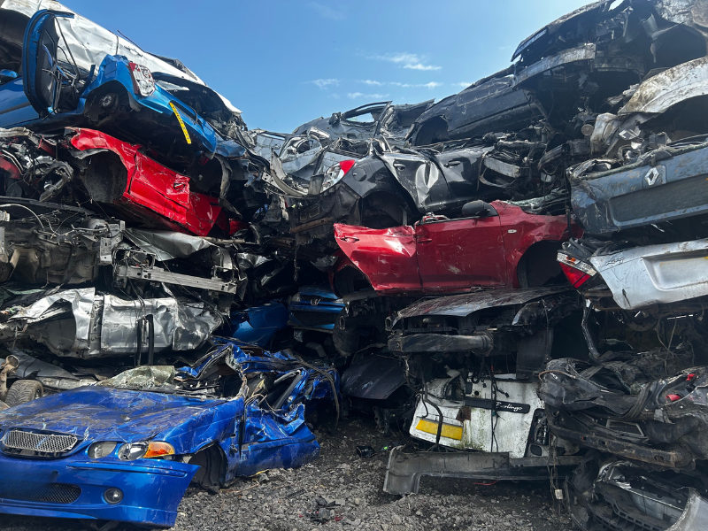 scrap car pile at Scrap Local