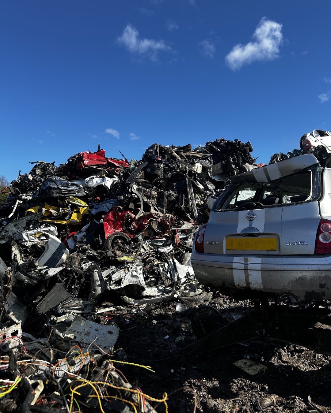 Pile of crushed cars in scrapyard